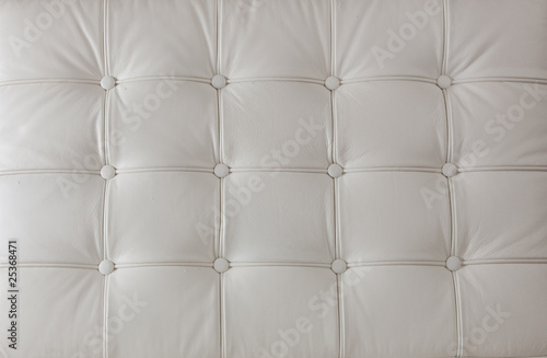 white genuine leather upholstery on the modern chair