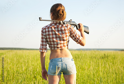 Girl with  pneumatic air  rifle