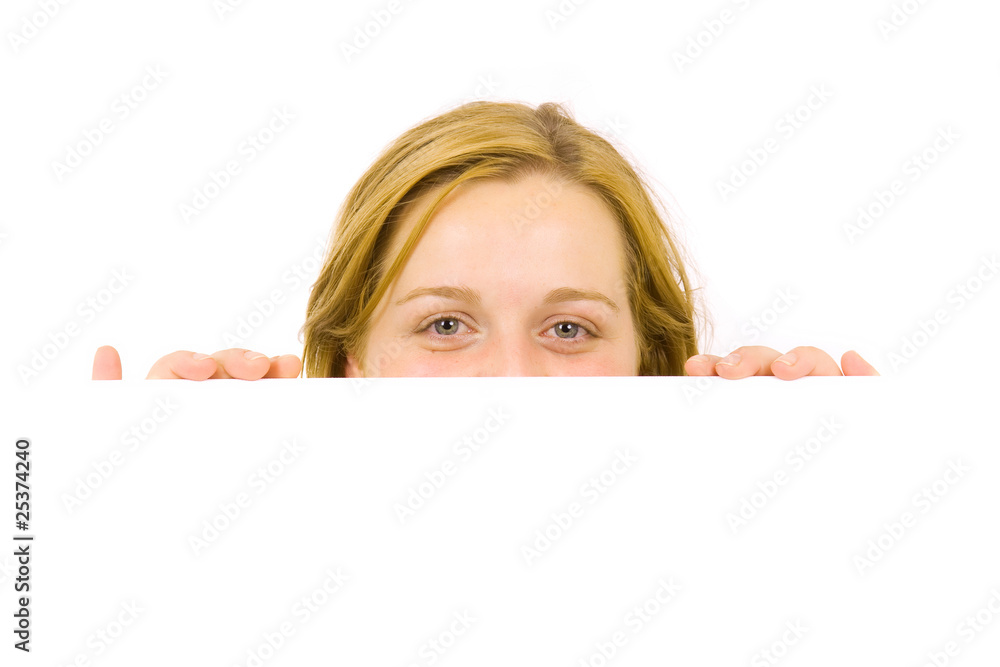 Fototapeta premium Portrait of a beautiful blond woman holding a blank billboard