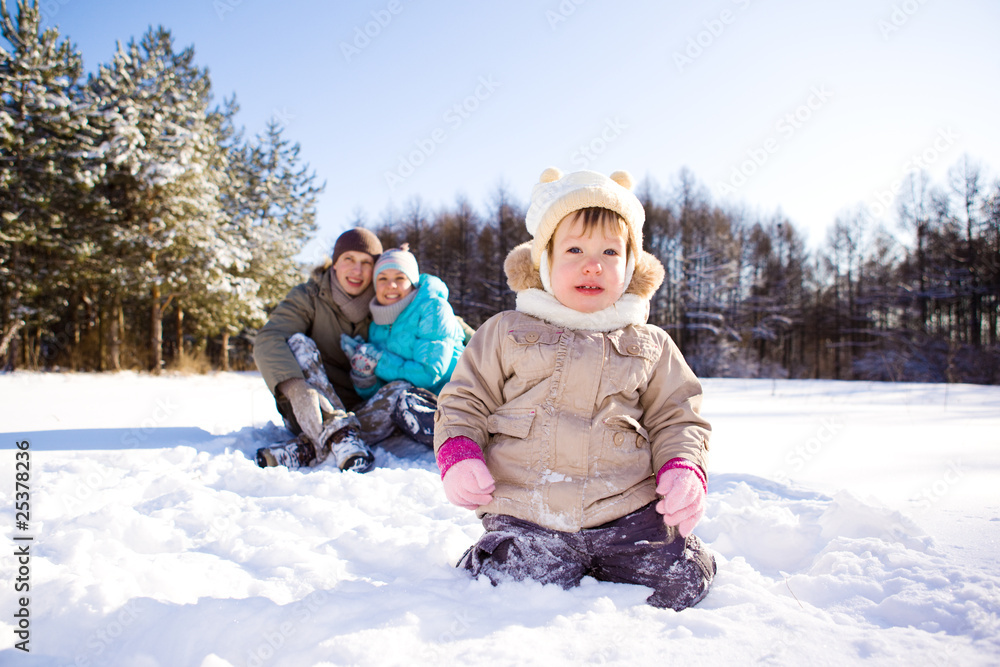 Winter toddler and her parents