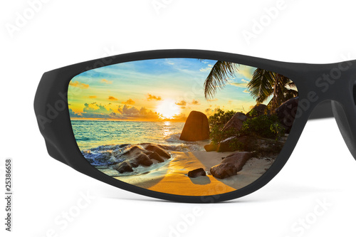 Sunglasses and seascape reflection