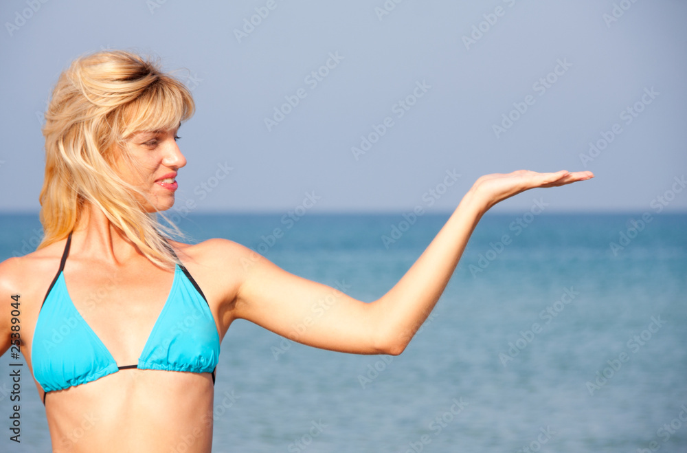Woman in bikini presenting the sea vacation Woman in bikini presenting the sea vacation
