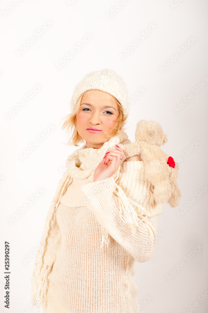 Happy winter girl in hat and gloves smiling Happy winter girl in hat and gloves smiling