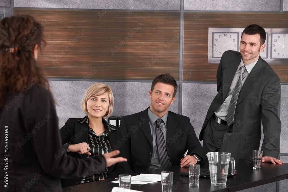 Fototapeta premium Partners listening to businesswoman