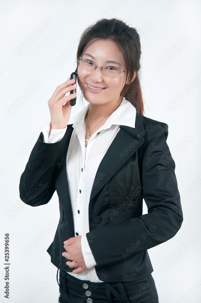 A chinese business woman on her cell phone A chinese business woman on her cell phone