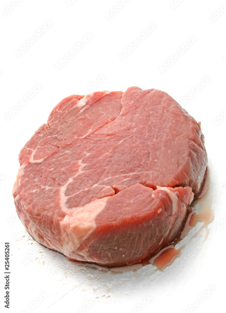 Freash cut of beef tenderloin on stell plate