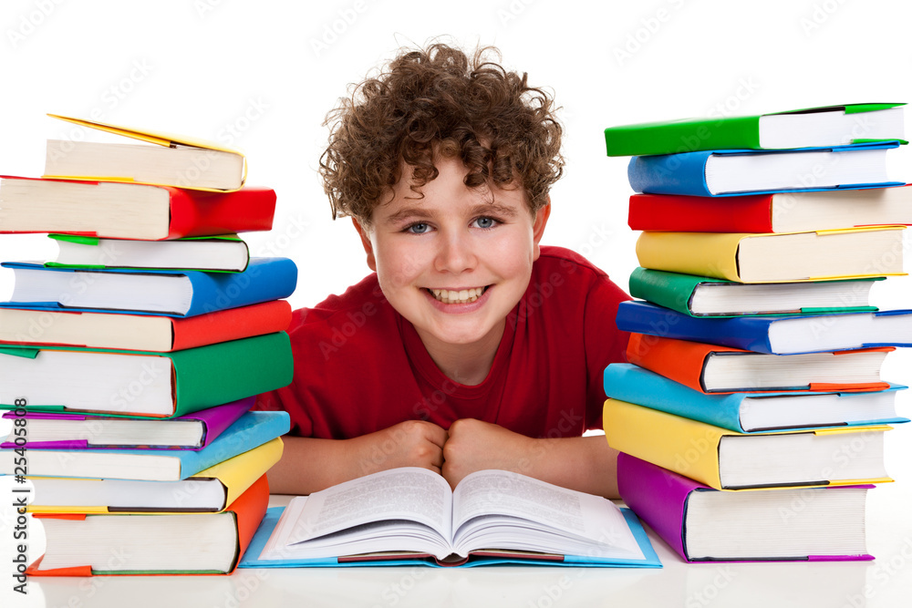 Boy between piles of books isolated on white Boy between piles of books isolated on white