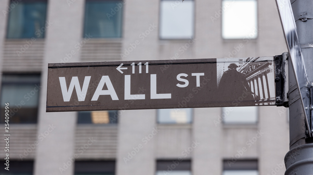 Wall Street road sign in the corner of New York Stock Exchange