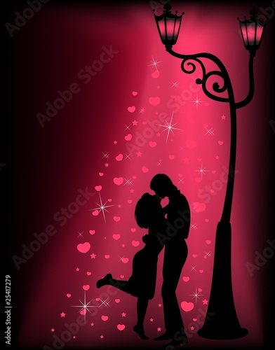 Silhouettes of two lovers under a lantern