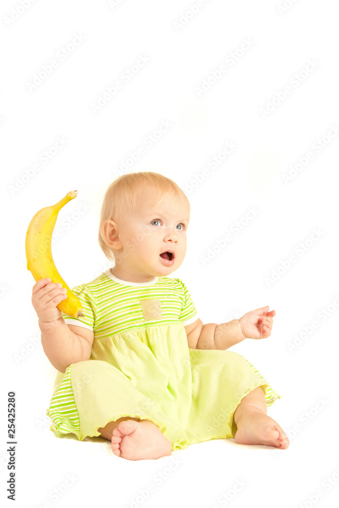 Young little baby eat yellow banana on white Young little baby eat yellow banana on white