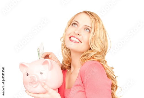 lovely woman with piggy bank and money