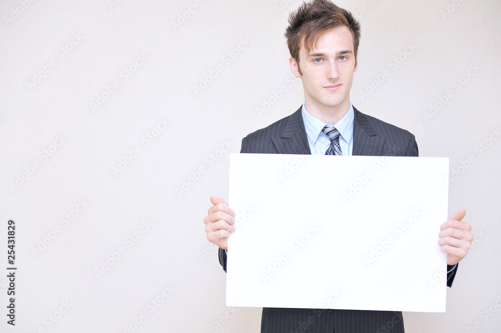 young business man holding a white board, young business man holding a white board,