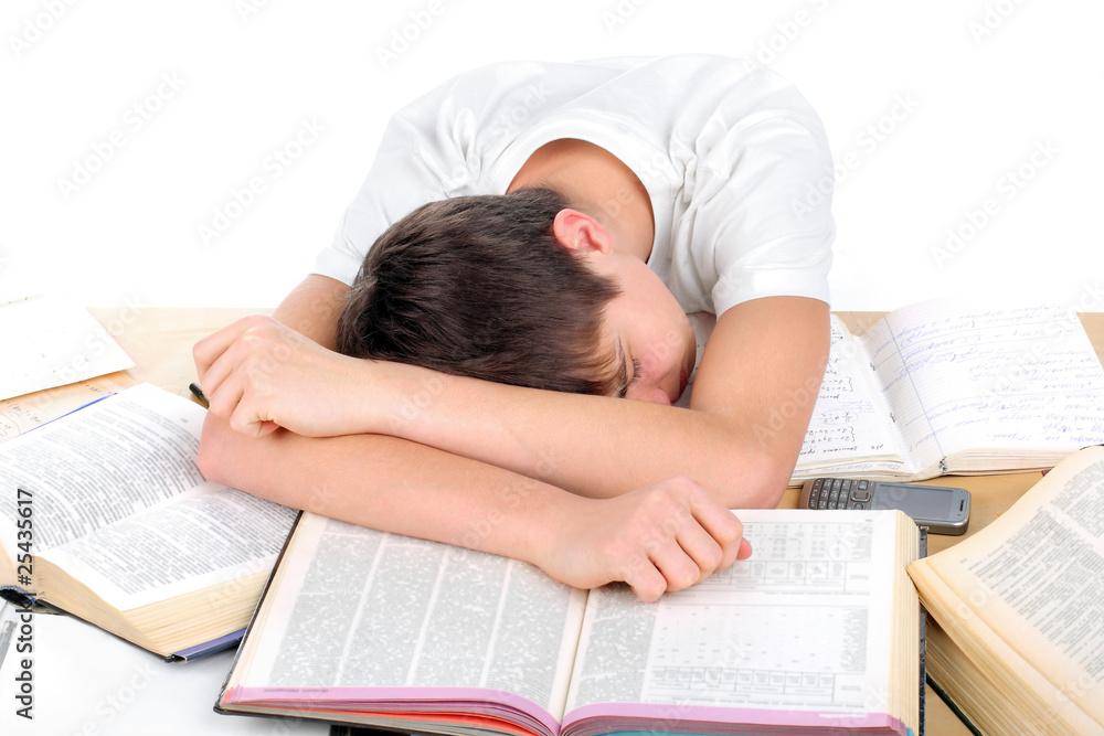 tired teenager lying and sleeping on the books tired teenager lying and sleeping on the books