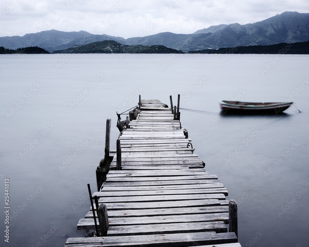 Fototapeta premium look on pier and boat, low saturation