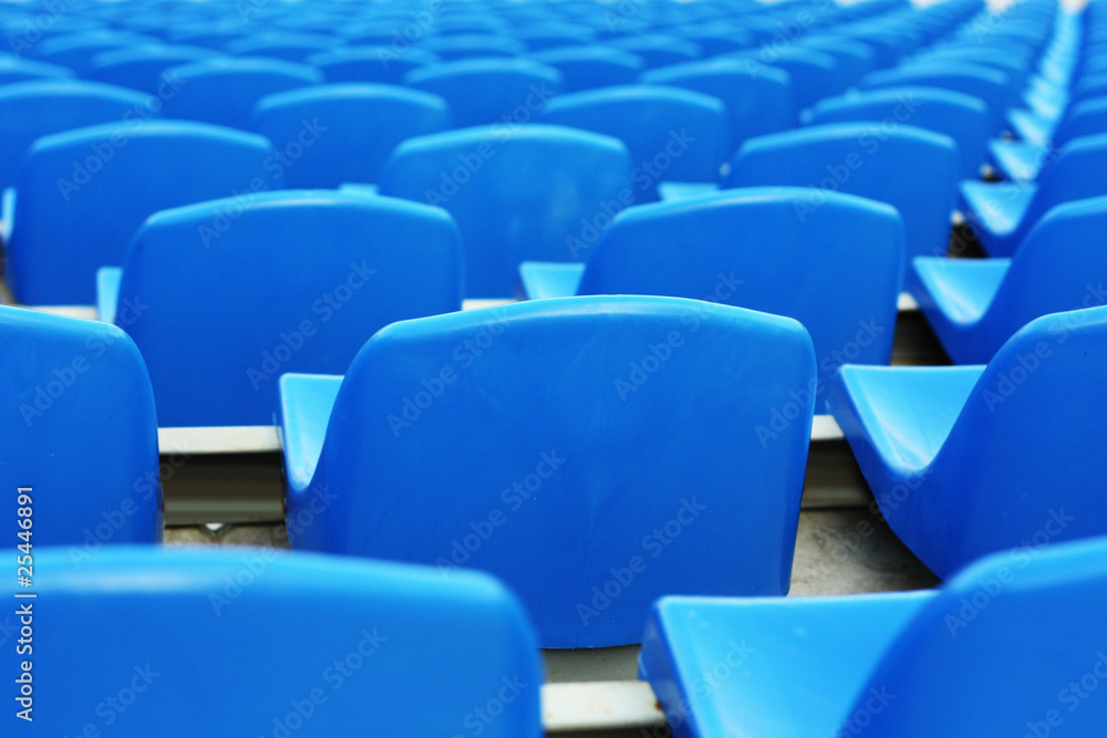 Naklejka premium Empty blue plastic stadium seats