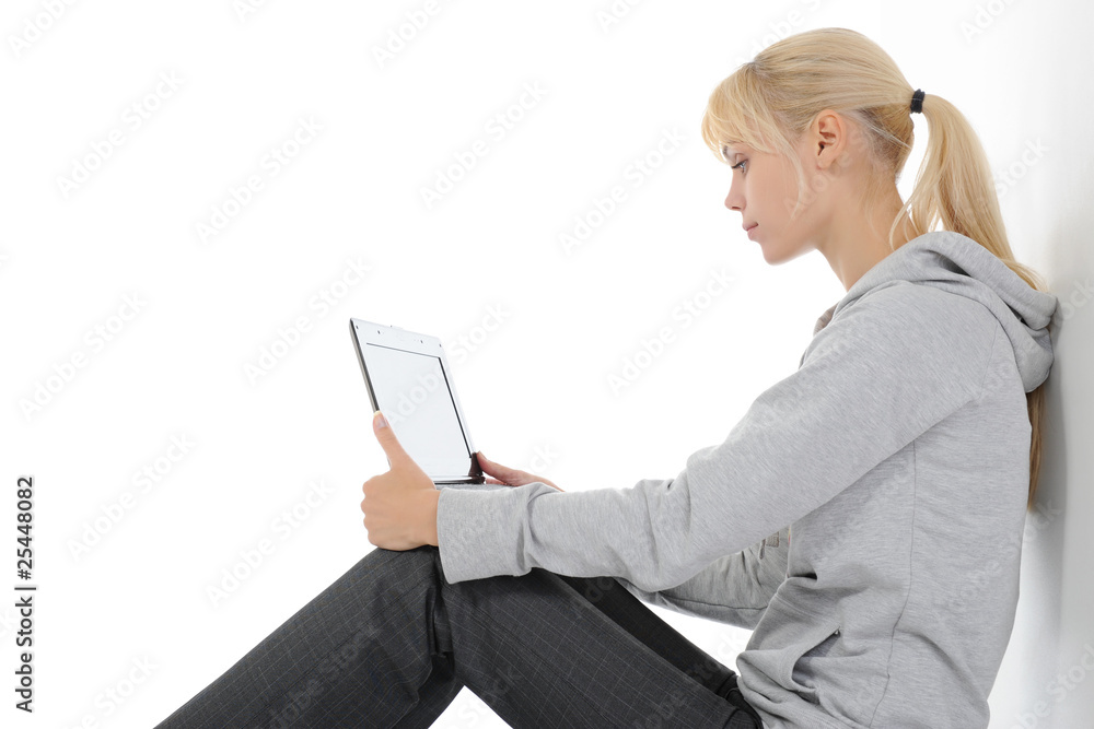 Blonde with a computer on his lap Blonde with a computer on his lap