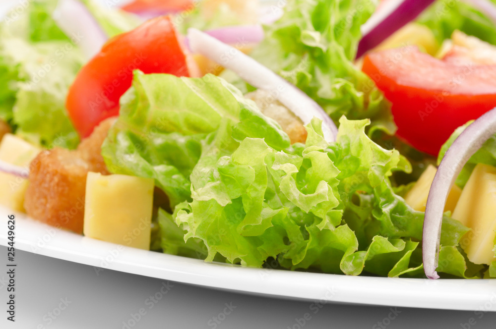 Close-up of salad on white plate Close-up of salad on white plate