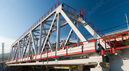 The metal bridge against a background of blue sky