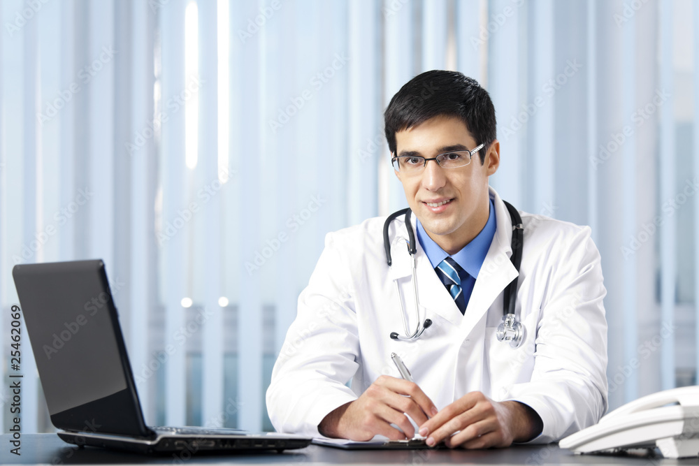 Successful doctor with laptop, at office Successful doctor with laptop, at office