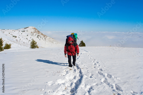 Hiker are in winter mountains
