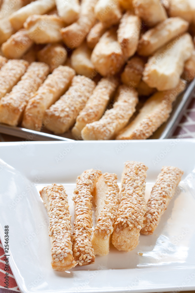 Pastry cakes with sesame on plate. Pastry cakes with sesame on plate.