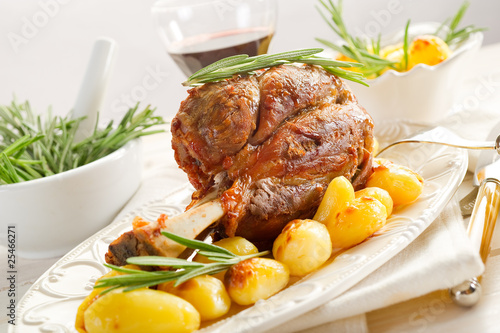 shank with potatoes - stinco con patate photo