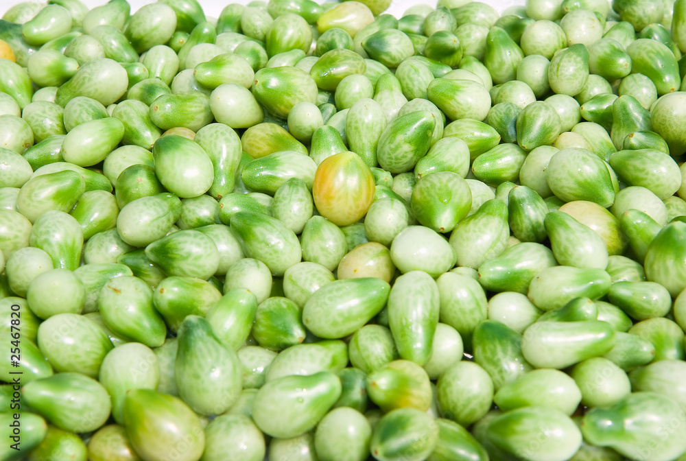 A background of fresh vine green tomatoes A background of fresh vine green tomatoes