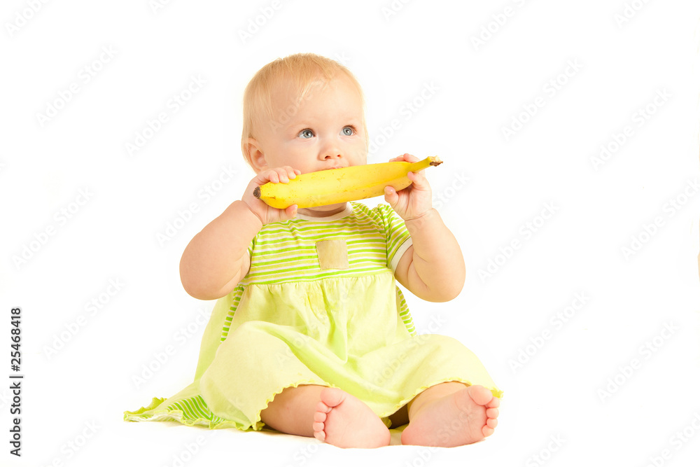 Young little baby eat yellow banana on white Young little baby eat yellow banana on white