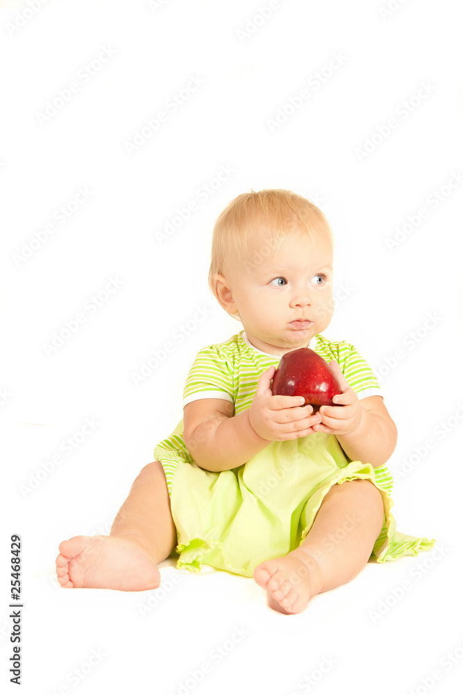 Young little baby eat red apple on white Young little baby eat red apple on white