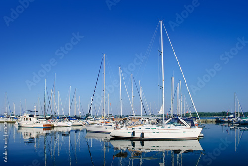 Luxury white yachts and boats moored in a port