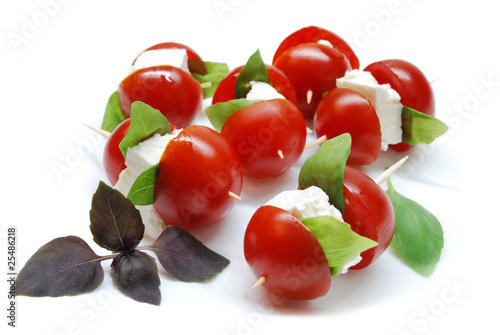 Cherry tomatoes with cheese and basil