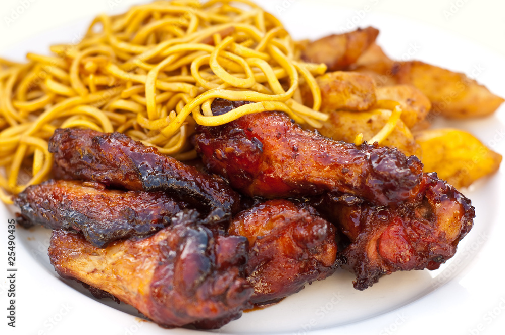chicken wings and strips with chinese noodles isolated chicken wings and strips with chinese noodles isolated