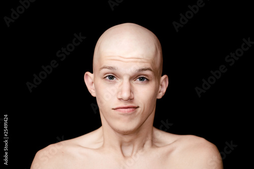 bald man isolated on a black