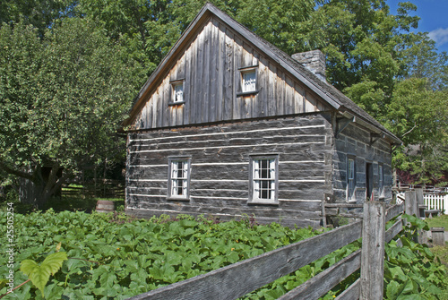 Old farmhouse with squash garden