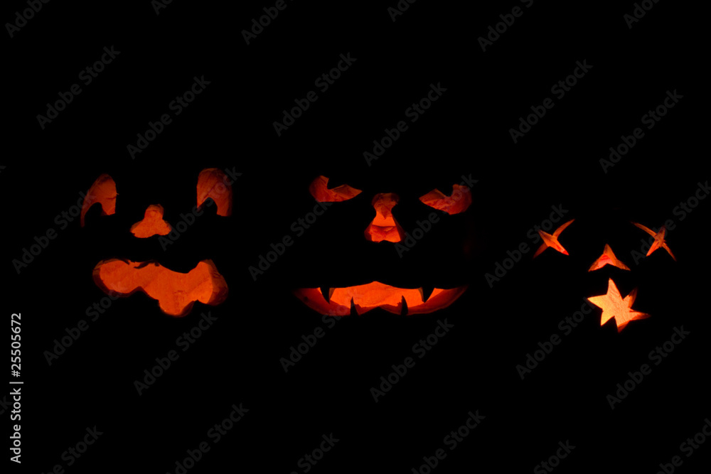 Three lit jack o-lanterns Three lit jack o-lanterns