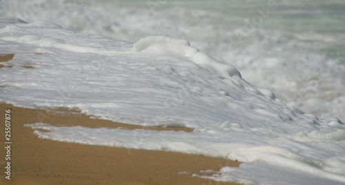 sea water splashing in the sand