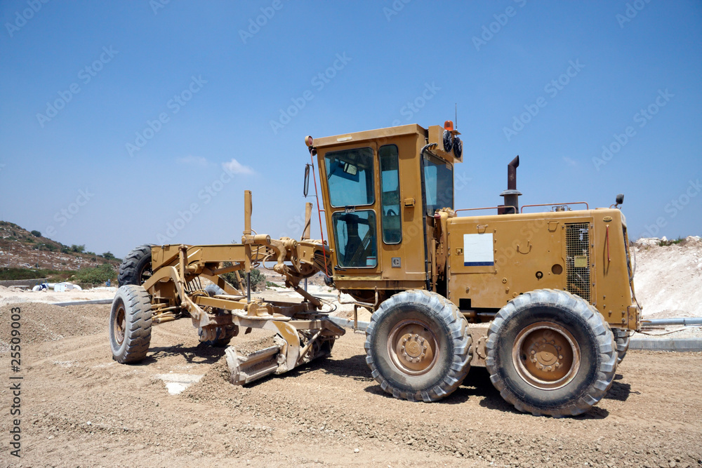 Large tractor working on a new road Large tractor working on a new road