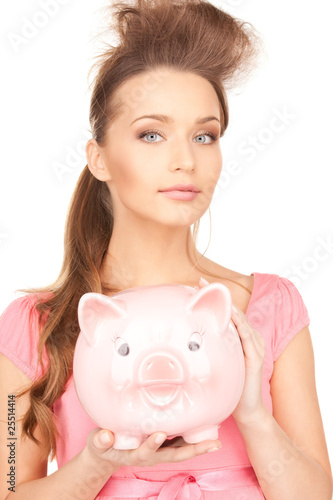 lovely woman with piggy bank