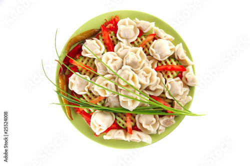dumplings served on green plate