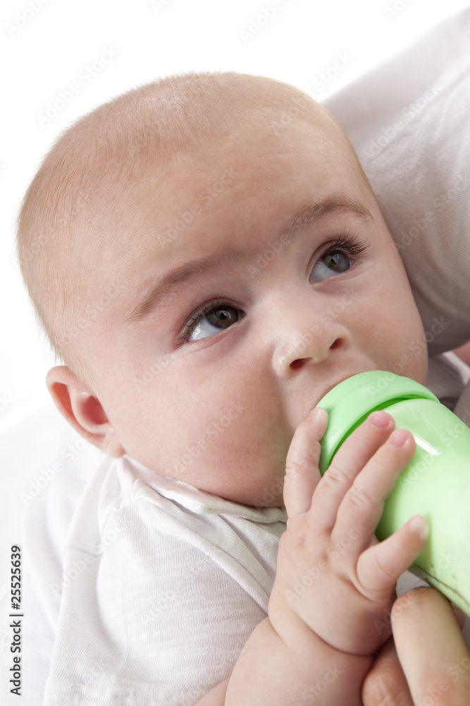 Baby boy drinking from a baby-bottle Baby boy drinking from a baby-bottle