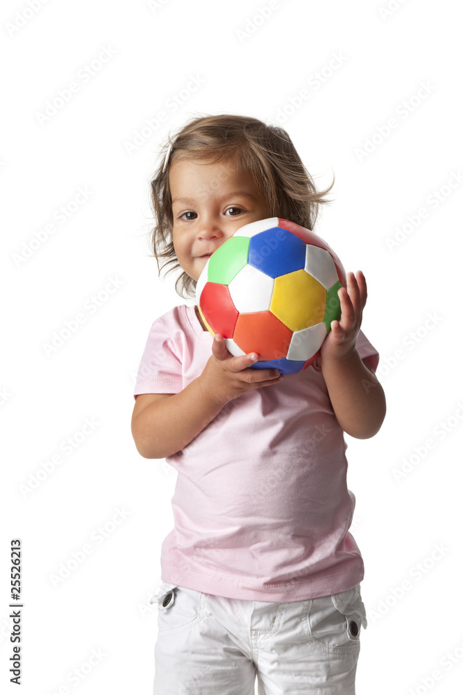 Toddler girl with a colored ball
