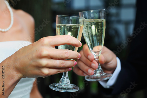 Bride & groom toasting with champagne sparkling wine