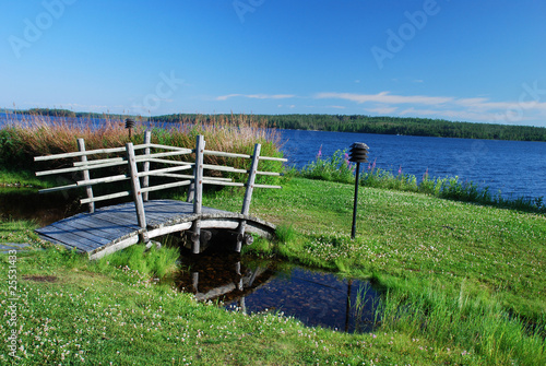 Small wooden bridge in surroundings of Suomussalmi photo