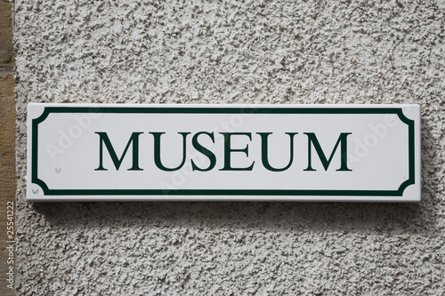 Museum Sign against Stone Wall
