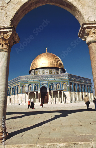 The afternoon sun shines on the golden Dome of the Rock