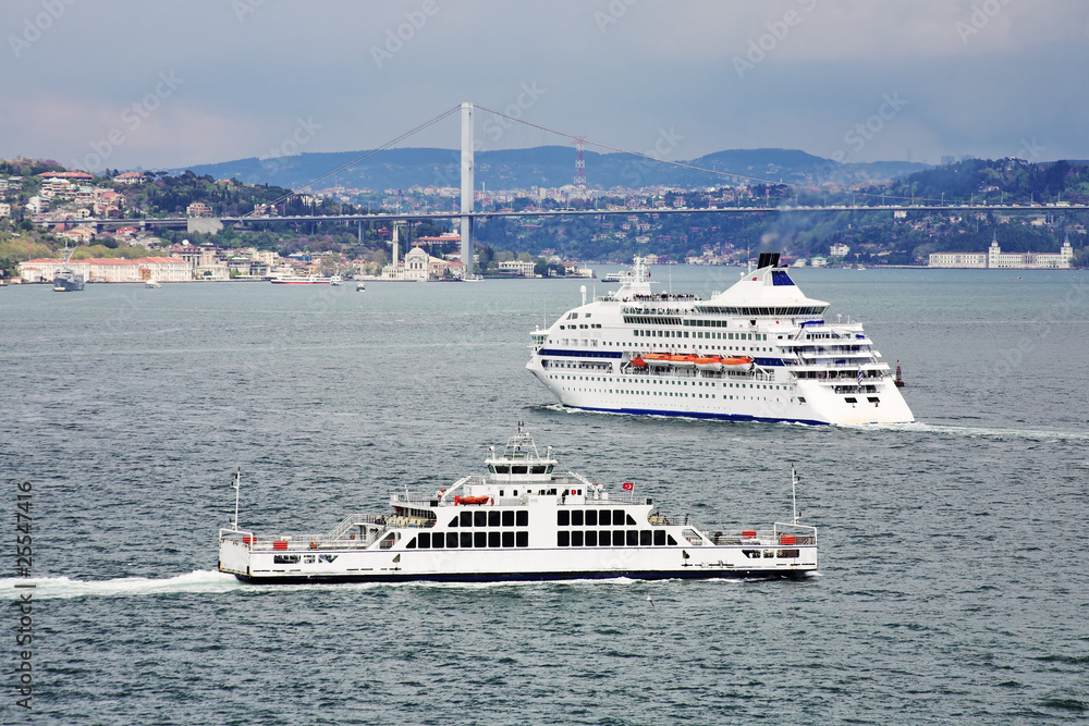 Passenger ship and ferry boat in the Bosporus in Istanbul Passenger ship and ferry boat in the Bosporus in Istanbul