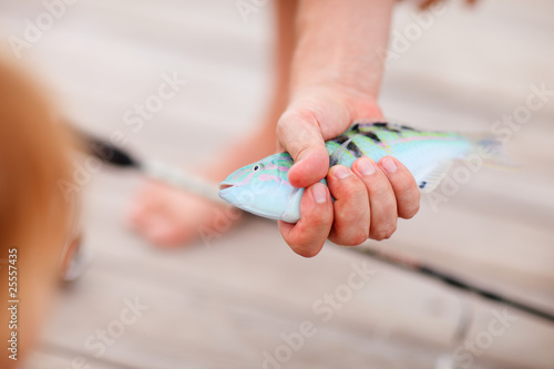 Fisherman holding fish