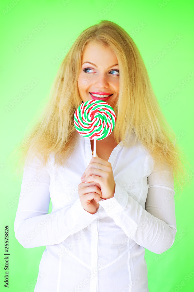 Beautiful girl holding lollipop