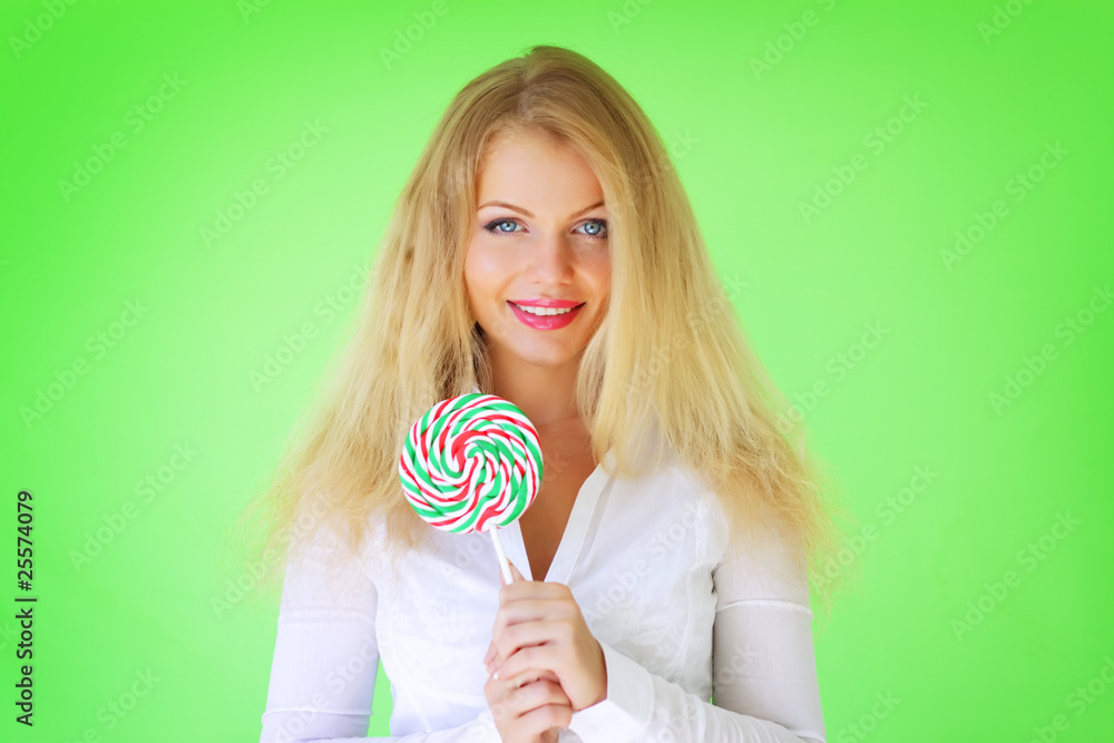 Beautiful girl holding lollipop