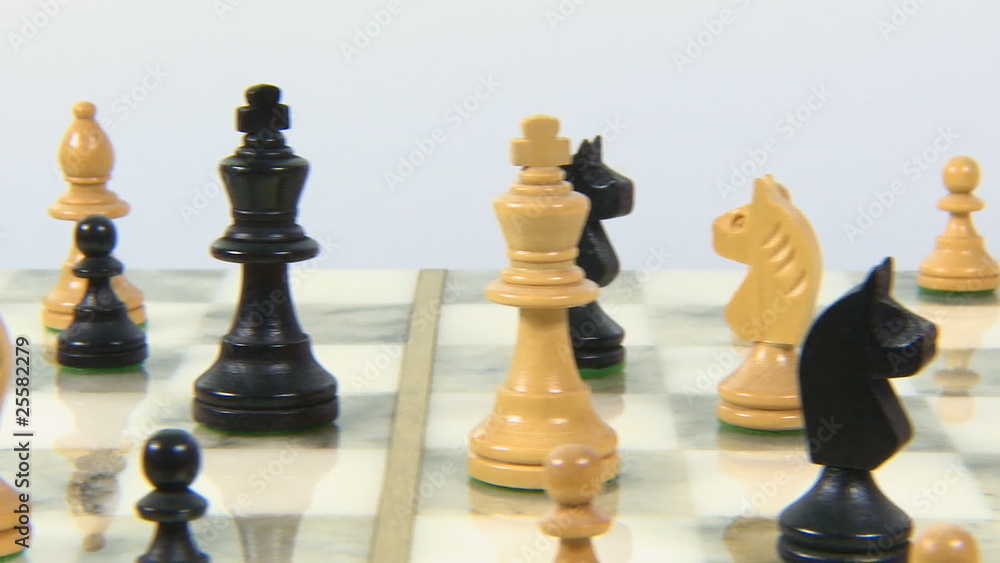 Chess board with chess pieces dolly left shot Chess board with chess pieces dolly left shot